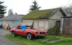 Old Camaro and Blue Tarps