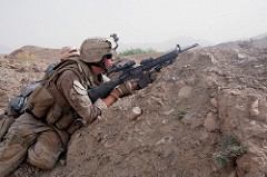 A Marine Fires on Insurgents in Afghanistan