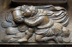 A monk takes a drink (with some enthusiam): 16th C. misericord, the Collegiate Church of Notre-Dame (Collégiale Notre-Dame), Le Puy-Notre-Dame, Anjou, France
