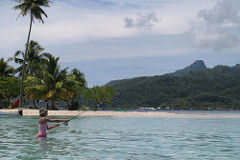 Patricia casting in the lagoon, Raiatea