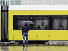 Man, Umbrella, Tram