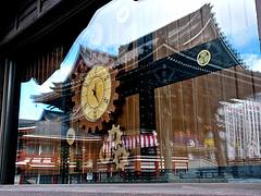 Ōsu Kannon 大須観音 Buddhist temple reflected in the Karakuri からくり人形 theatre's clock window. Located in Ōsu, in central Nagoya, Japan