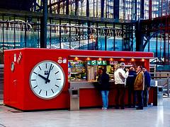 A Quick Snack! Fast Bar Clock in the Principe Pío Station in Madrid Spain A Quick Snack! Fast Bar Clock in the Principe Pío Station in Madrid Spain