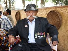 Bukhara, Lyabi-Hauz Square, old man with medals and large moustache