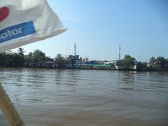 Rantauan Darat seen from the (U/C) riverwalk across from the Banjarmasin City Hall .
