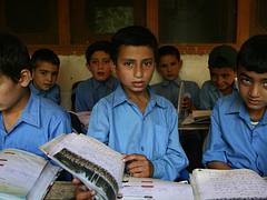 Students from a school supported by Hashoo Foundation in Chitral look on as they attend class.