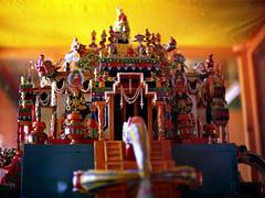 Details of Tibetan Buddhist Hevajra or Kalachakra Deity Palace on double vajras, Buddhas, decor, zephrs, vases, encased in glass, Tibetan Works and Archives Library, 1993 pilgrimage, Dharamsala, India Details of Tibetan Buddhist Hevajra or Kalachakra Deity Palace on double vajras, Buddhas, decor, zephrs, vases, encased in glass, Tibetan Works and Archives Library, 1993 pilgrimage, Dharamsala, India