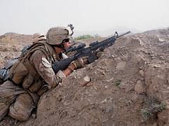 A Marine Fires on Insurgents in Afghanistan
