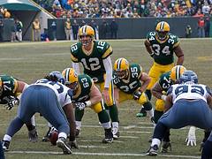 Aaron Rodgers (12), Korey Hall (35) and Ahman Green (34) Aaron Rodgers (12), Korey Hall (35) and Ahman Green (34)