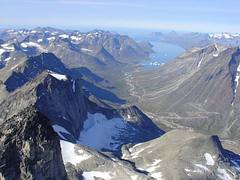 Nalunaq Gold Mine (looking southwest) (mine adits are along steep slopes of tall mountain at right, above switchback roads)