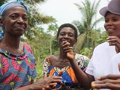 Women singing and dancing at a community meeting in Kananga, DRC
